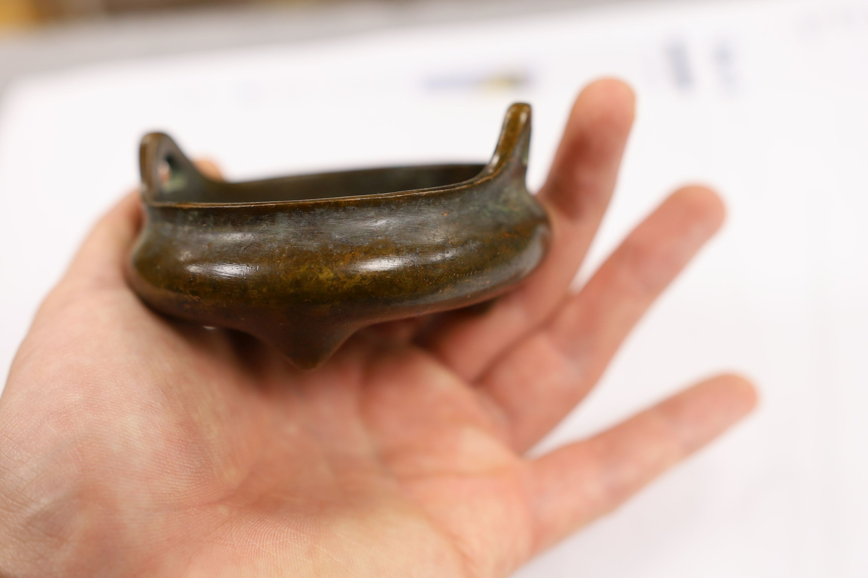 Two Chinese bronze censers, largest 11cms diameter